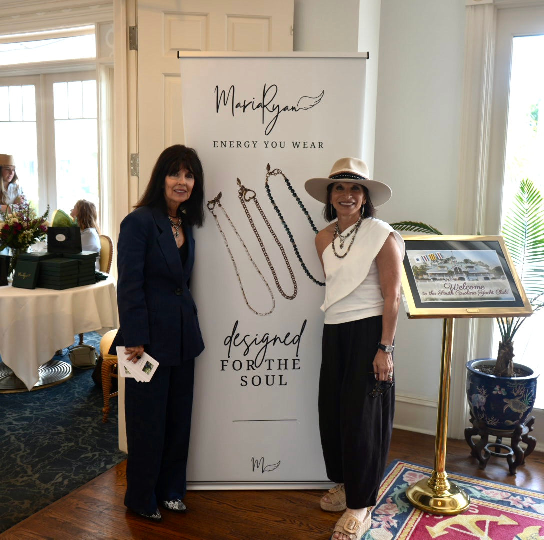 Trunk show banner display of MariaRyan Jewelry with Mary Ryan and another woman standing in front