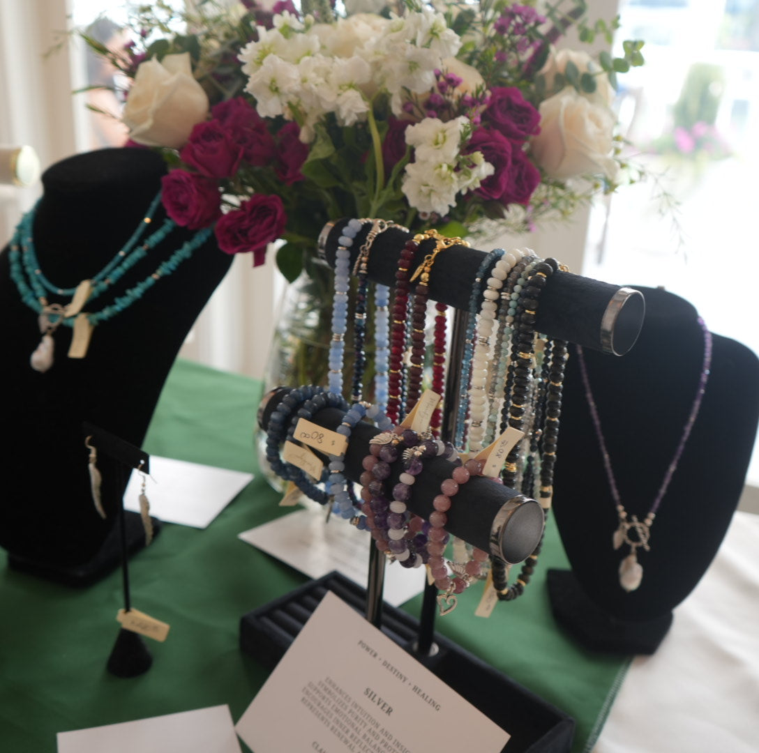 Trunk show jewelry display of exclusive and featured MariaRyan Jewelry necklaces, bracelets, and earrings