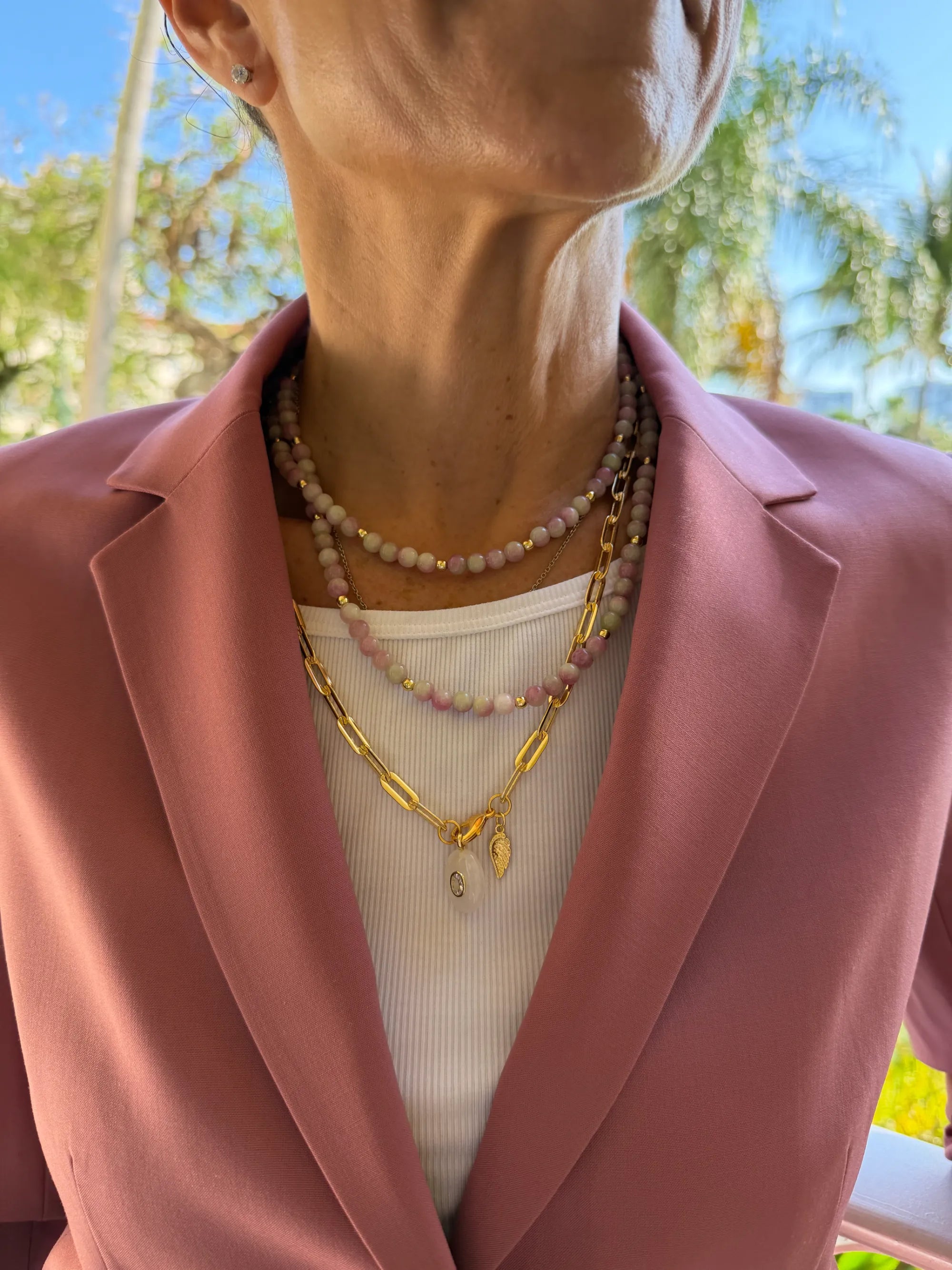 Co-founder Laura Ravo, in a pink balzer with layered necklaces by MariaRyan Jewelry